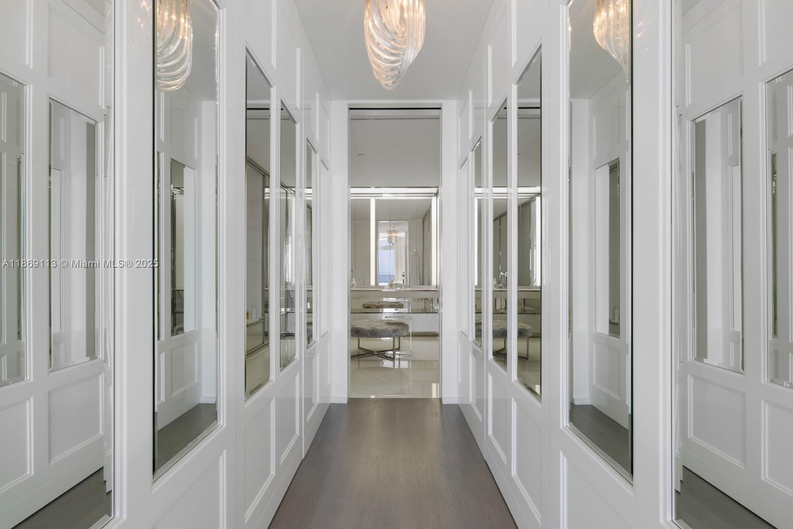 3315 Collins Avenue, Unit 10B Miami Beach, FL 33140 - Photo 19 of 42 a view of a hallway with windows and brick walls