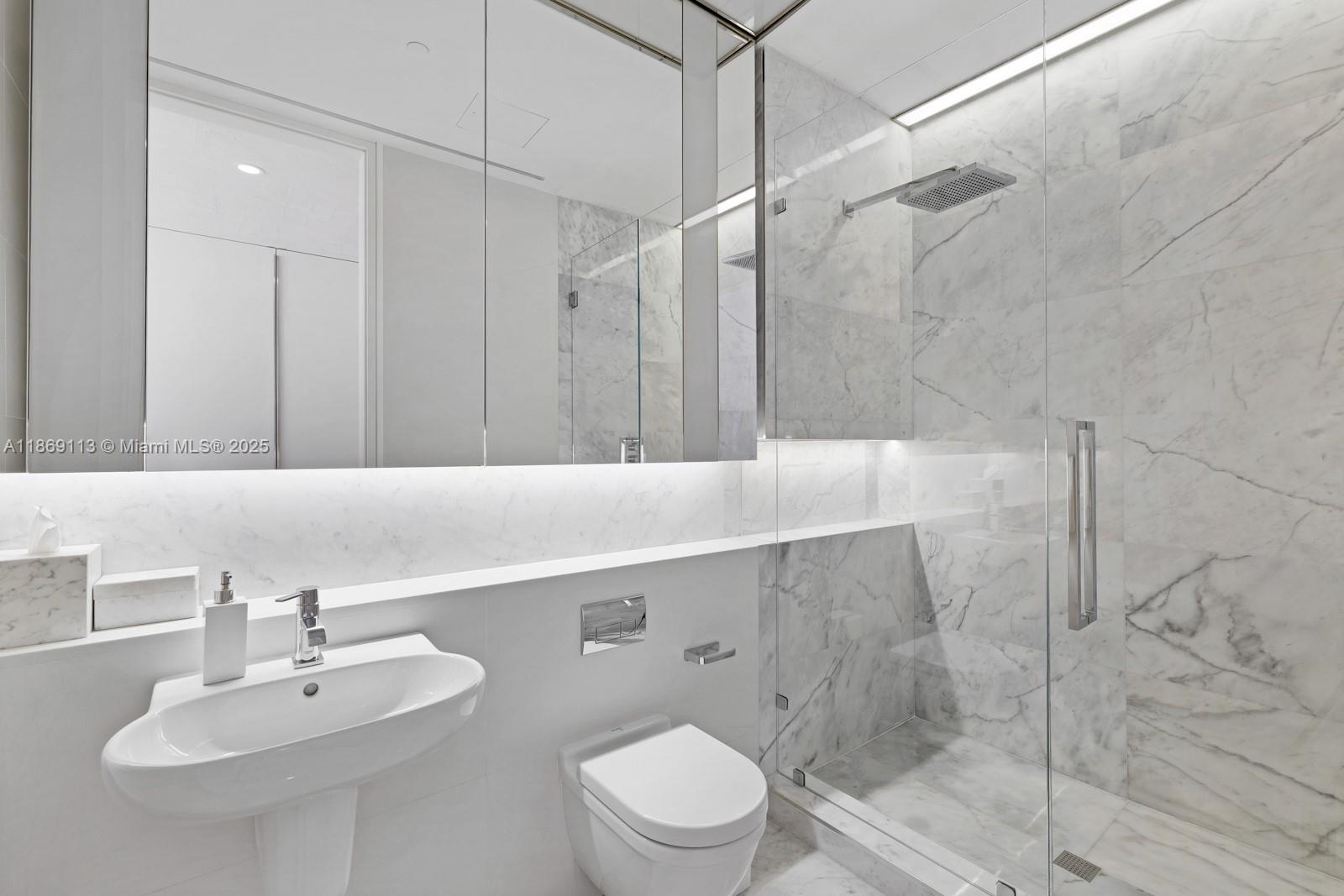 3315 Collins Avenue, Unit 10B Miami Beach, FL 33140 - Photo 23 of 42 a bathroom with a sink toilet and shower