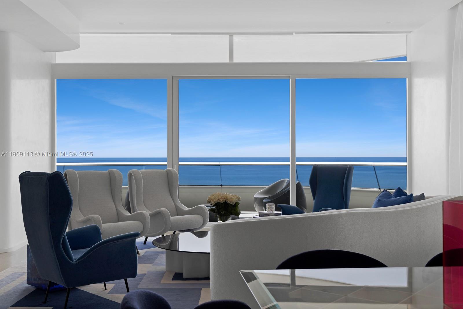 3315 Collins Avenue, Unit 10B Miami Beach, FL 33140 - Photo 3 of 42 a living room with a couch