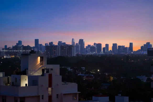 a view of a city with tall buildings in the background
