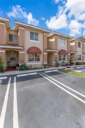 a city street lined with buildings and cars