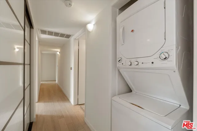 a view of a hallway with washer and dryer