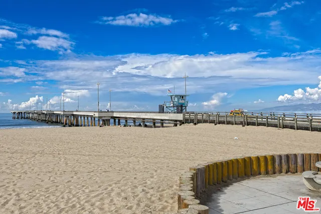 a view of swimming pool and city from a lake
