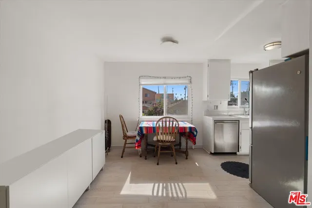 a spacious bedroom with a bed and a window