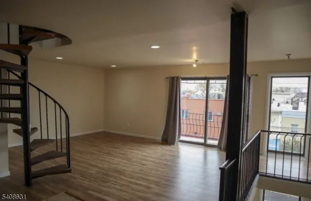 a view of entryway with wooden floor