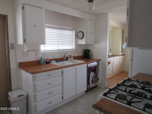 a kitchen with a stove and a sink