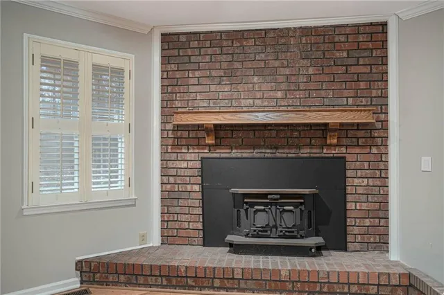 a view of fireplace and window