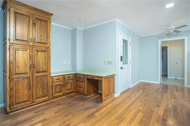 a view of a kitchen with wooden floor