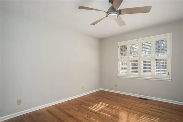 a view of a room with wooden walls