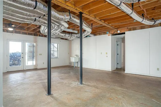 a view of a room with wooden floor