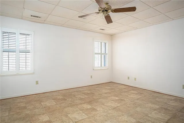 a view of porch with a small yard