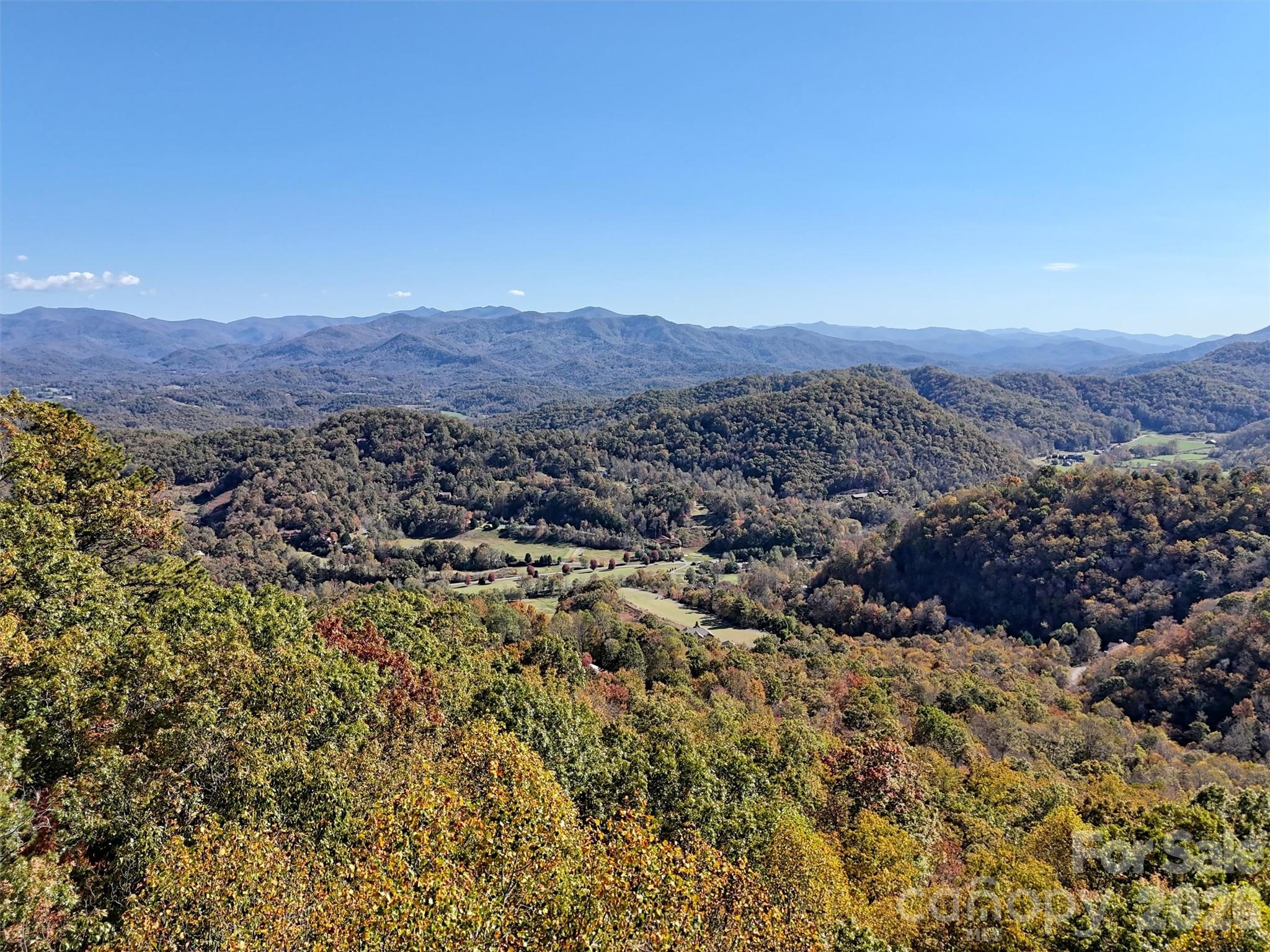 a view of a city with mountains in the background