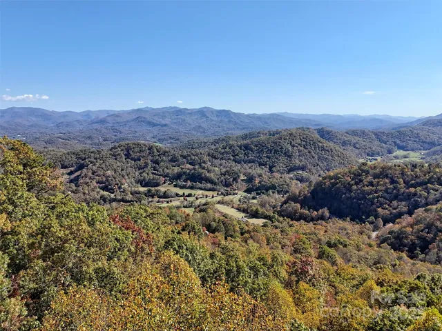 a view of a city with mountains in the background