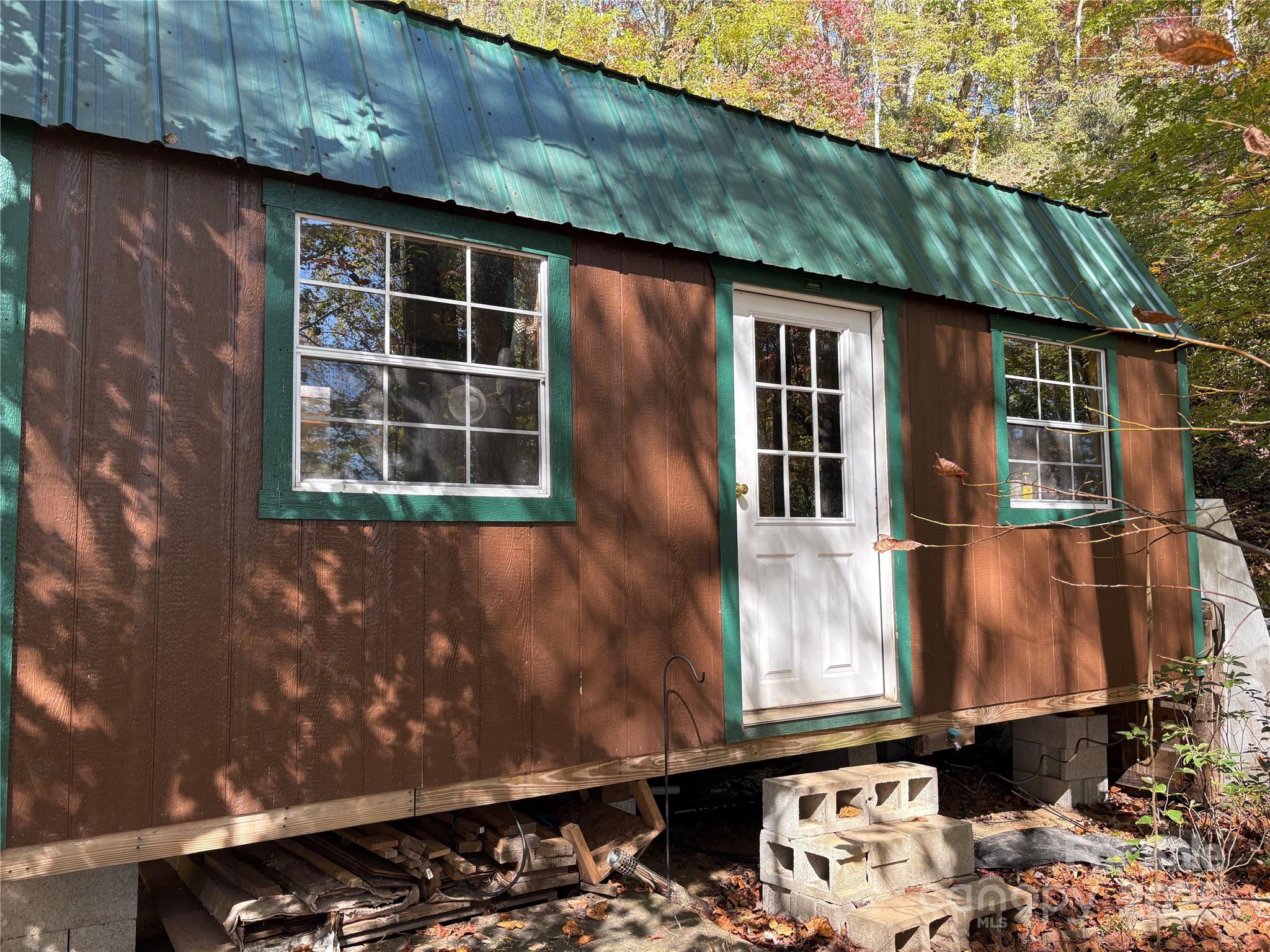 0 Mack Luke Road, Unit 7 Whittier, NC 28789 - Photo 24 of 25 a front view of a house with a garden