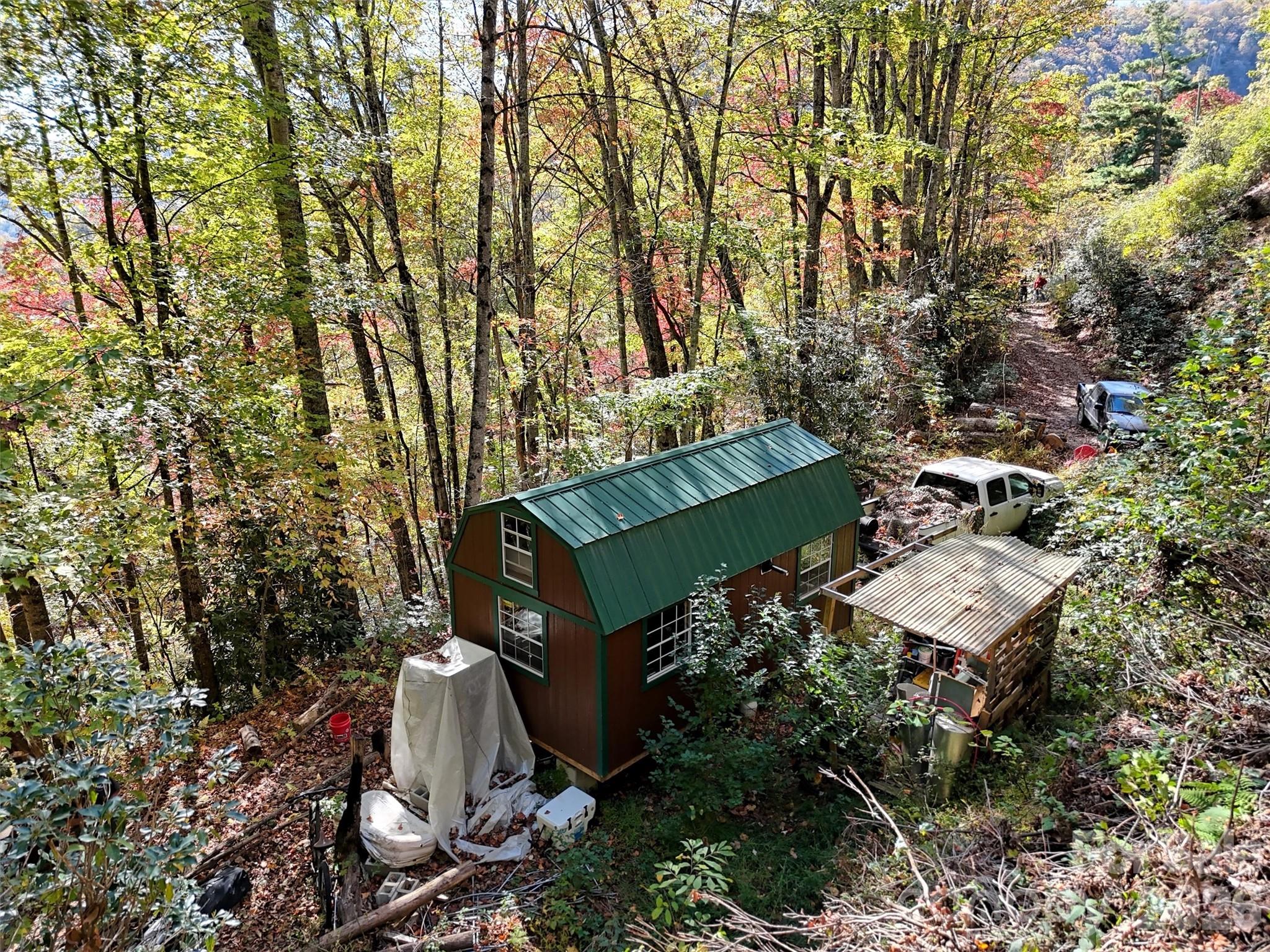 0 Mack Luke Road, Unit 7 Whittier, NC 28789 - Photo 5 of 25 an aerial view of a house with a yard and tree s