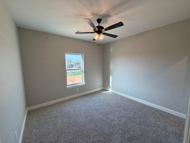 230 Kilkenny Road Poolville, TX 76487 - Photo 20 of 22 an empty room with a window and a fan