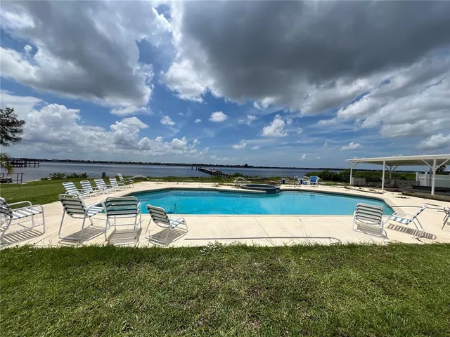 an aerial view of a house with a lake view