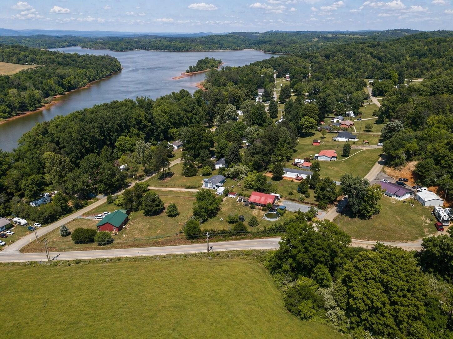 145 Rogers Road Birchwood, TN 37308 - Photo 18 of 21 an aerial view of a house with a garden and lake view