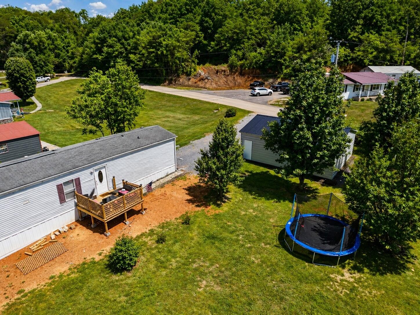 145 Rogers Road Birchwood, TN 37308 - Photo 20 of 21 a backyard of a house with a yard and outdoor seating