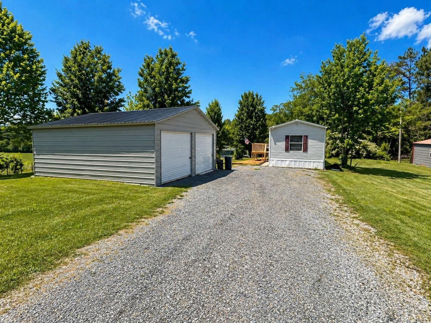 145 Rogers Road Birchwood, TN 37308 - Photo 2 of 21 a front view of a house with a yard and garage