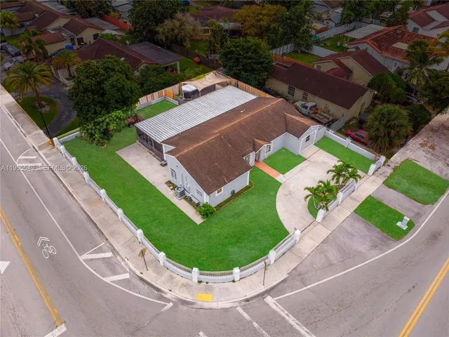 an aerial view of a house with a garden
