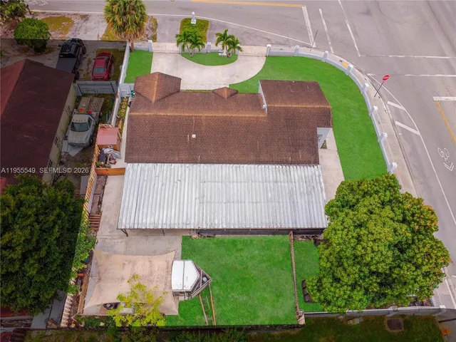 a bedroom with a bed and a table