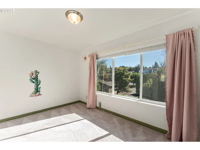 a view of a room with a window and storage