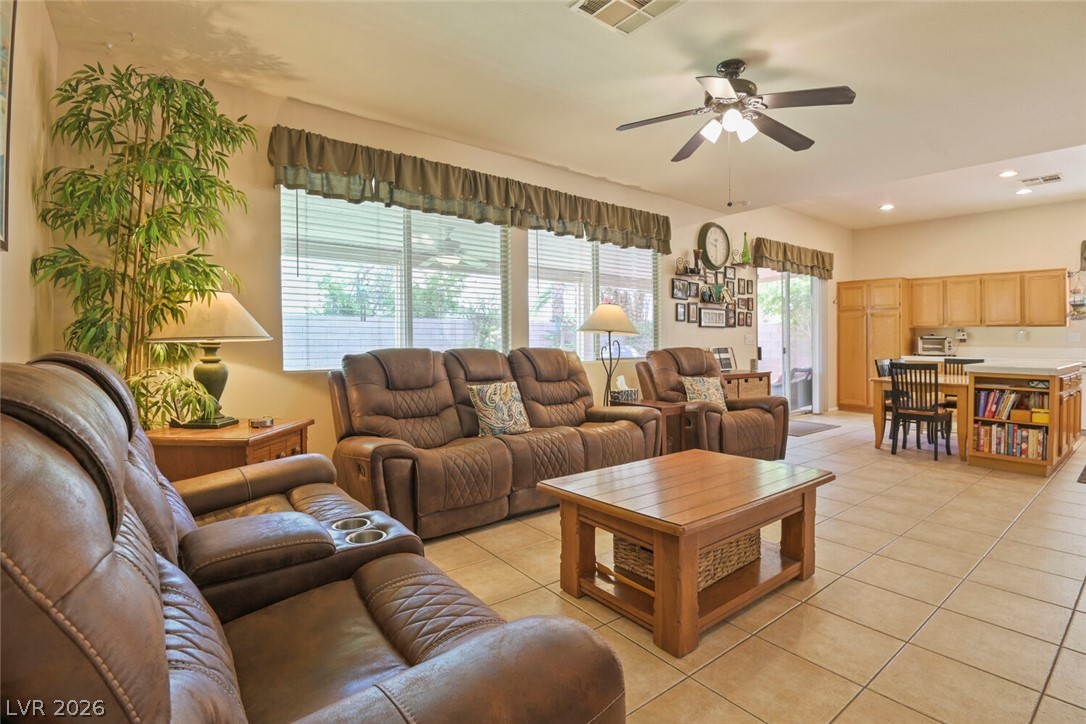 2356 Tilden Way Henderson, NV 89074 - Photo 9 of 30 Relax in this comfortable living space with integrated kitchen access, ideal for daily living.