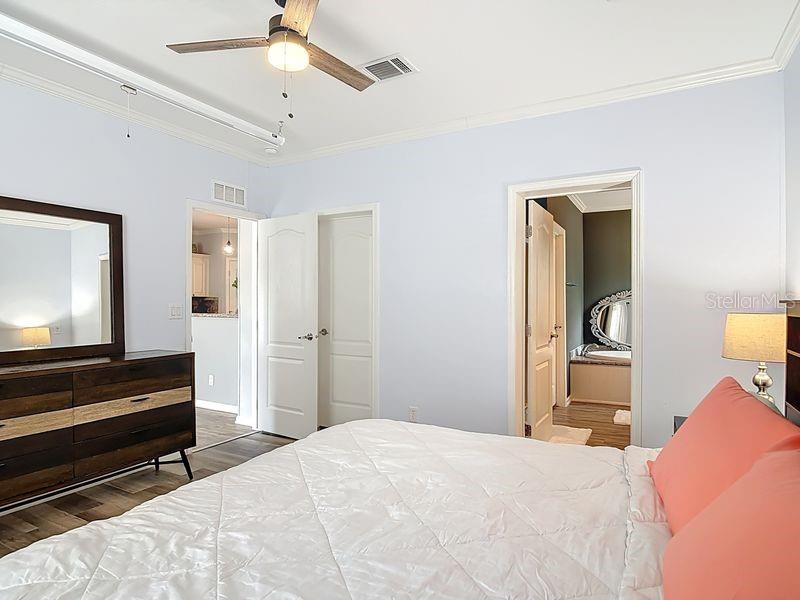 102 Ash Street Edgewater, FL 32141 - Photo 19 of 36 a bedroom with a bed and a television
