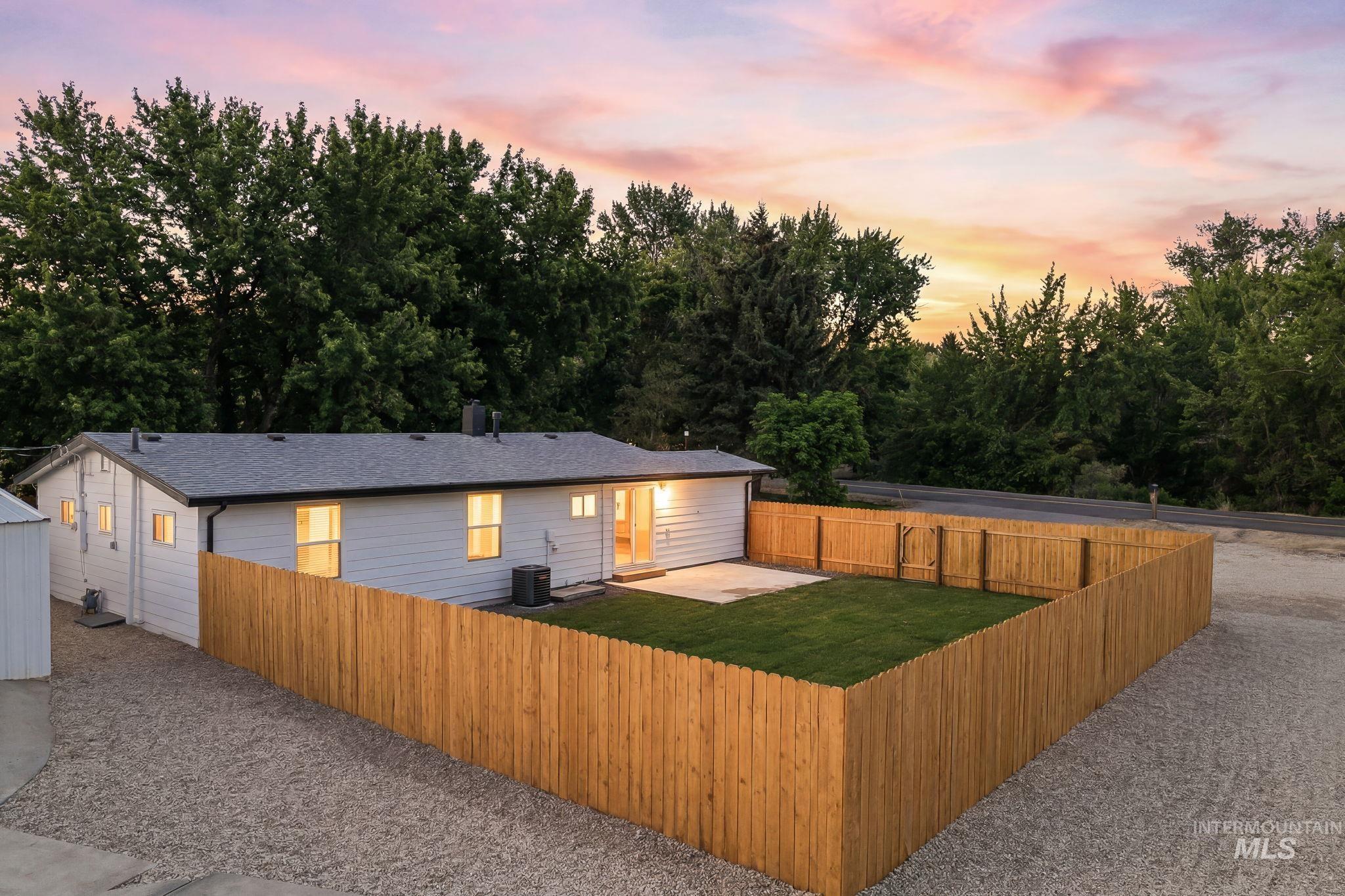 2152 Artesian Road Eagle, ID 83616 - Photo 40 of 50 Expansive, fenced backyard featuring a manicured lawn, concrete patio, and a privacy fence