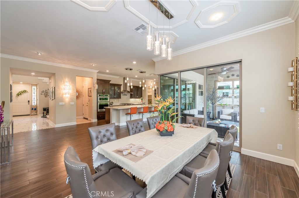 126 Nickel Irvine, CA 92618 - Photo 16 of 59 a view of a dining room and livingroom with furniture wooden floor a chandelier