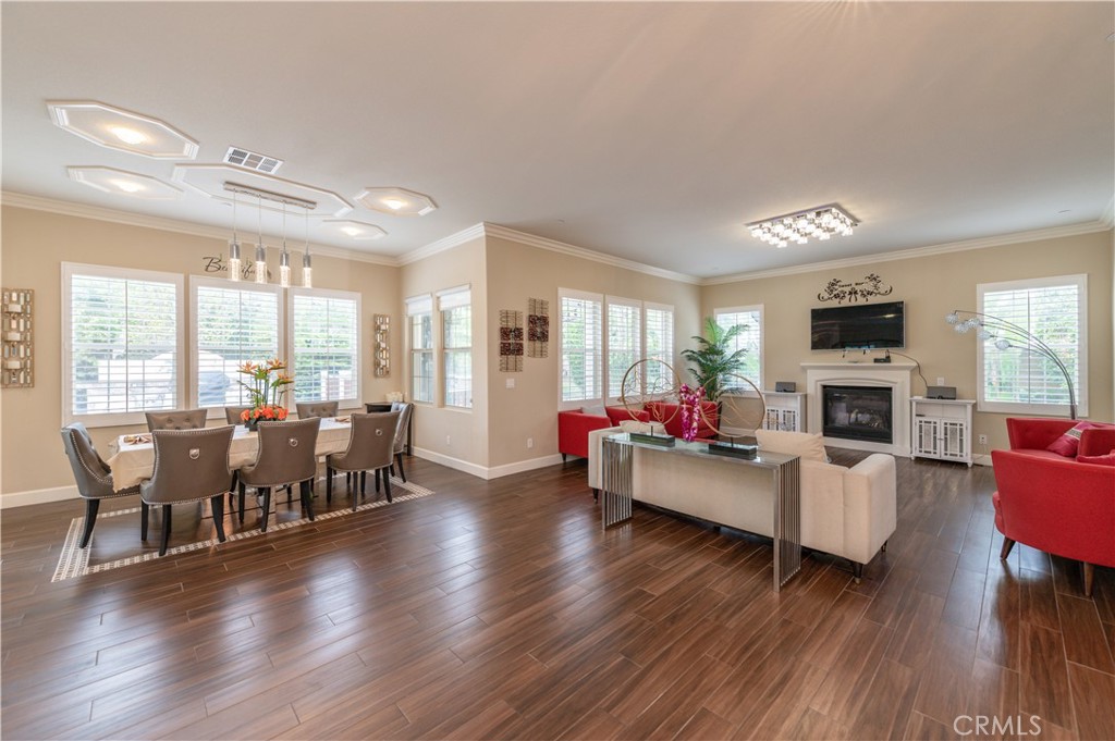 126 Nickel Irvine, CA 92618 - Photo 21 of 59 a living room with furniture dining table a flat screen tv and large windows