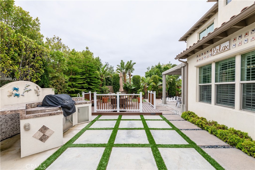 126 Nickel Irvine, CA 92618 - Photo 28 of 59 a view of a patio with couches and table and chairs with wooden floor and fence