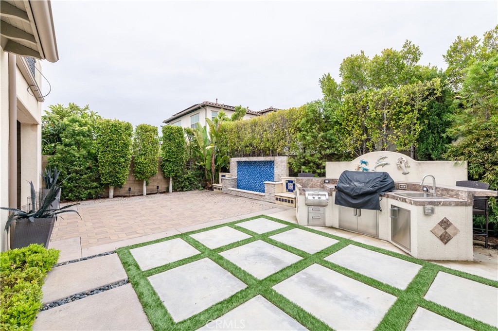 126 Nickel Irvine, CA 92618 - Photo 29 of 59 a view of a patio with table and chairs potted plants with wooden floor