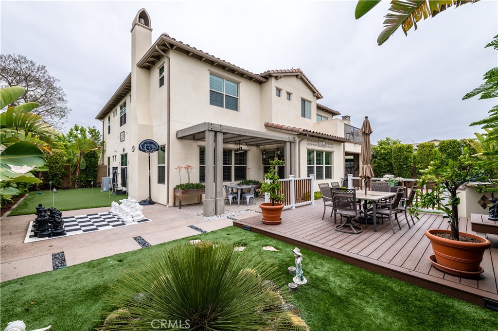126 Nickel Irvine, CA 92618 - Photo 32 of 59 a view of a house with patio and a yard