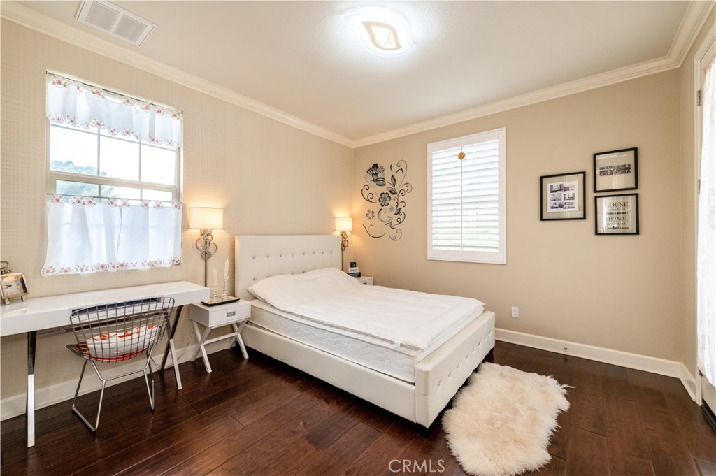 126 Nickel Irvine, CA 92618 - Photo 38 of 59 a bedroom with a bed table and windows