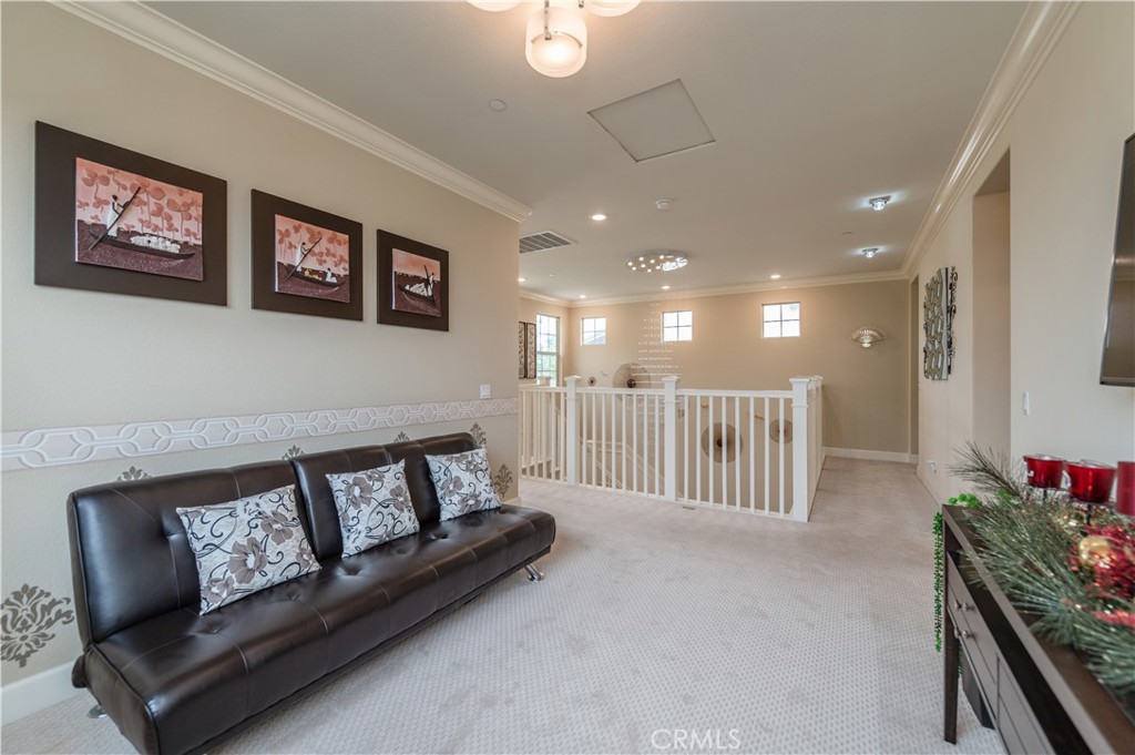 126 Nickel Irvine, CA 92618 - Photo 43 of 59 a living room with furniture and a flat screen tv