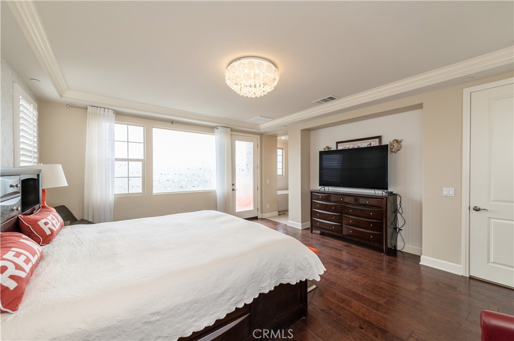 126 Nickel Irvine, CA 92618 - Photo 49 of 59 a bedroom with a bed and a flat screen tv