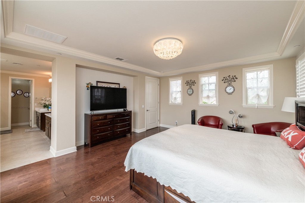 126 Nickel Irvine, CA 92618 - Photo 50 of 59 a bedroom with a bed and a flat screen tv