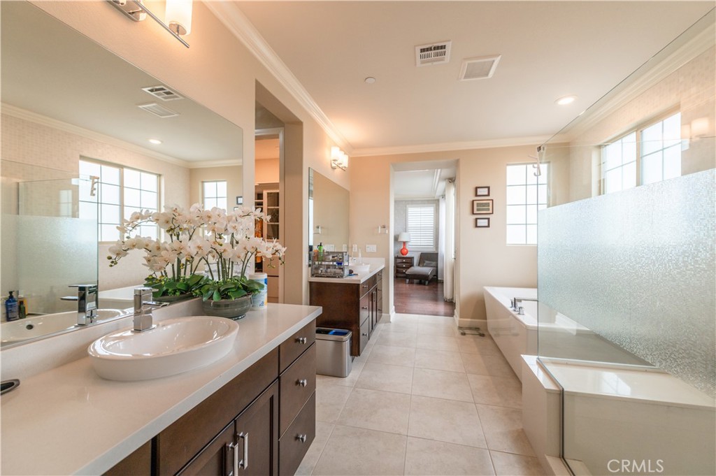 126 Nickel Irvine, CA 92618 - Photo 54 of 59 a bathroom with a double vanity sink mirror and
