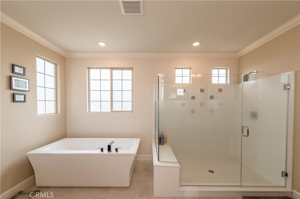 126 Nickel Irvine, CA 92618 - Photo 55 of 59 a bathroom with a bathtub and shower