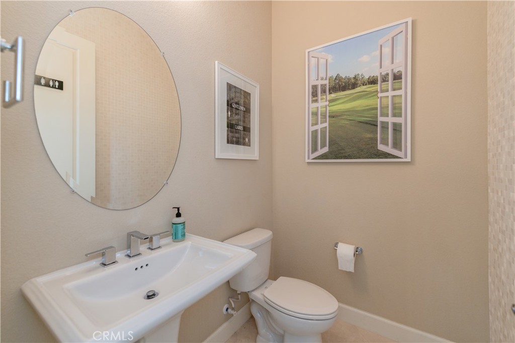 126 Nickel Irvine, CA 92618 - Photo 8 of 59 a bathroom with a toilet a sink a mirror and a window