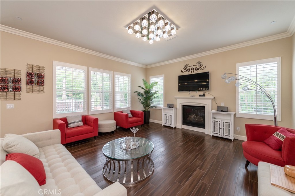 126 Nickel Irvine, CA 92618 - Photo 9 of 59 a living room with furniture a fireplace and a flat screen tv