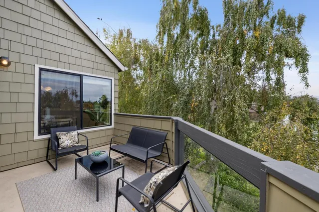 a view of a two chairs in the balcony