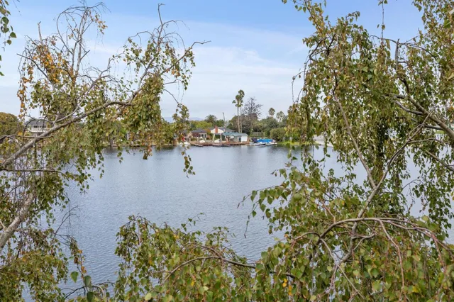 a view of a lake with a building in the background