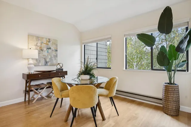 a view of a dining room with furniture window and flowerpot