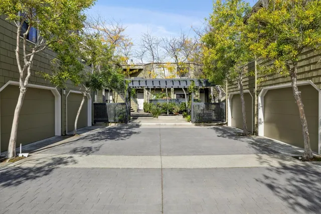 a backyard of a house with shaded area