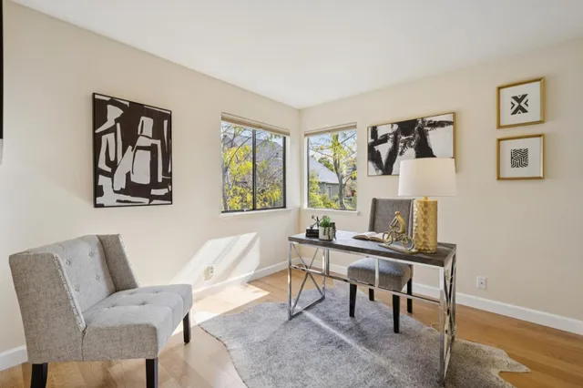 a view of a livingroom with workspace and a couch