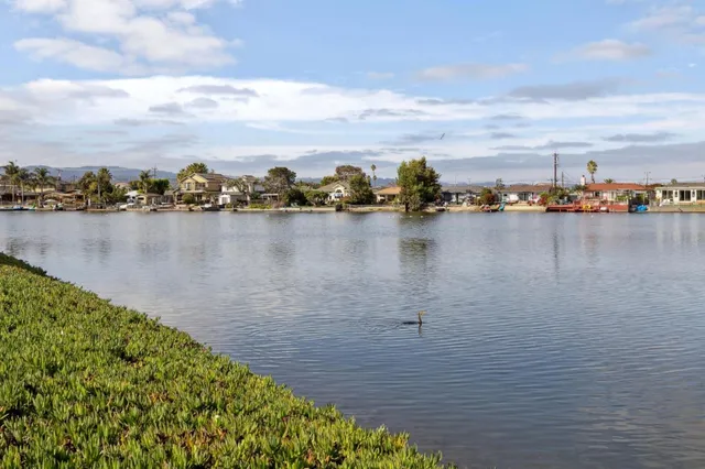 a view of a chair and table on the wooden floor