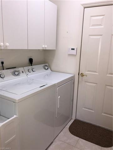 9008 Springview Loop Estero, FL 33928 - Photo 11 of 11 Laundry room with cabinets for storage